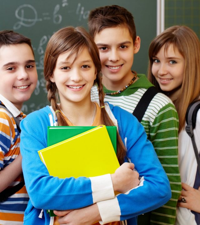 Smart students Portrait of happy teens looking at camera with smiles